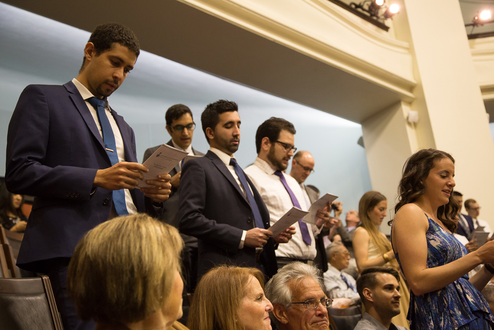 Valedictorian Louai Musa and his classmates recite the MD Graduation Oath