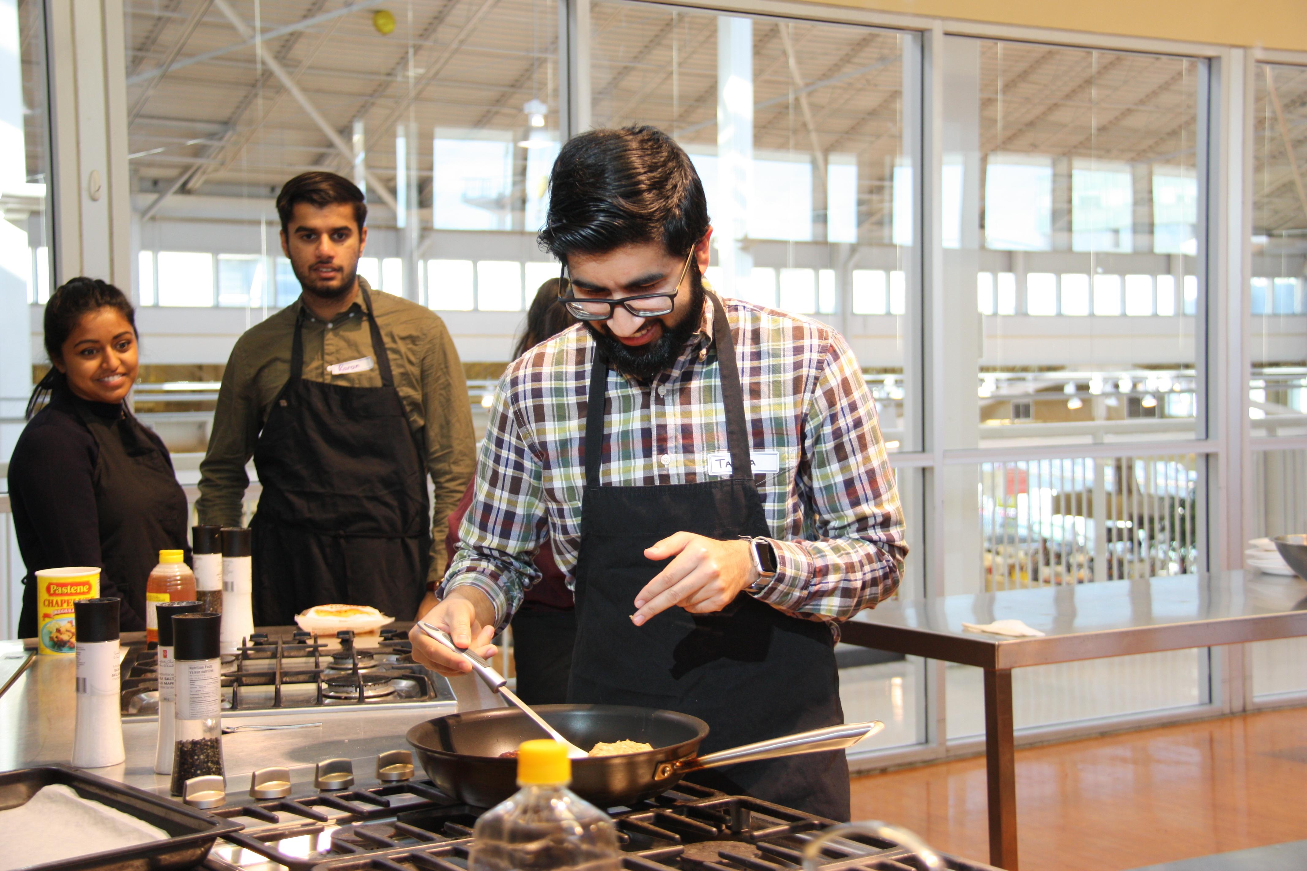 MEDICAL STUDENT TAAHA MUHAMMAD TRIES HIS HAND AT COOKING