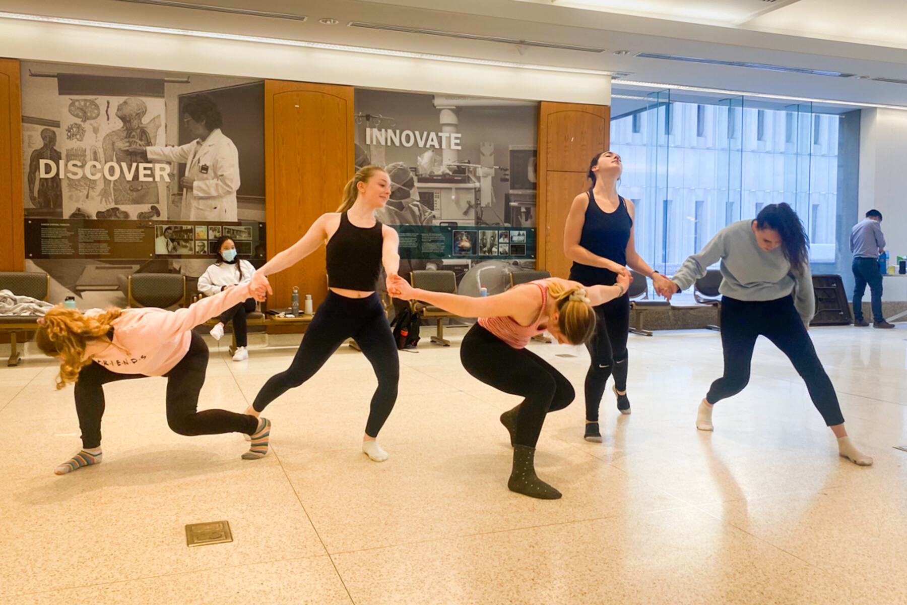 Dancers rehearse in the Naylor Student Commons at Temerty Medicine