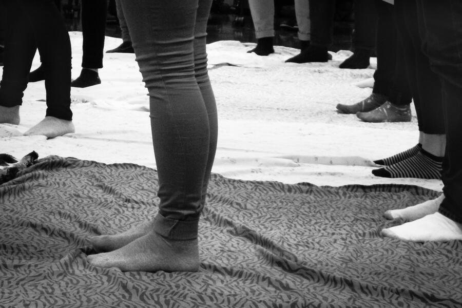 Unidentifiable students participate in the Blanket Exercise.