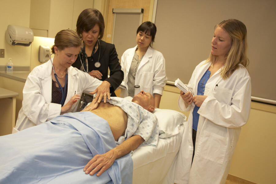 PROFESSOR JACQUELINE JAMES WORKS WITH STUDENTS.