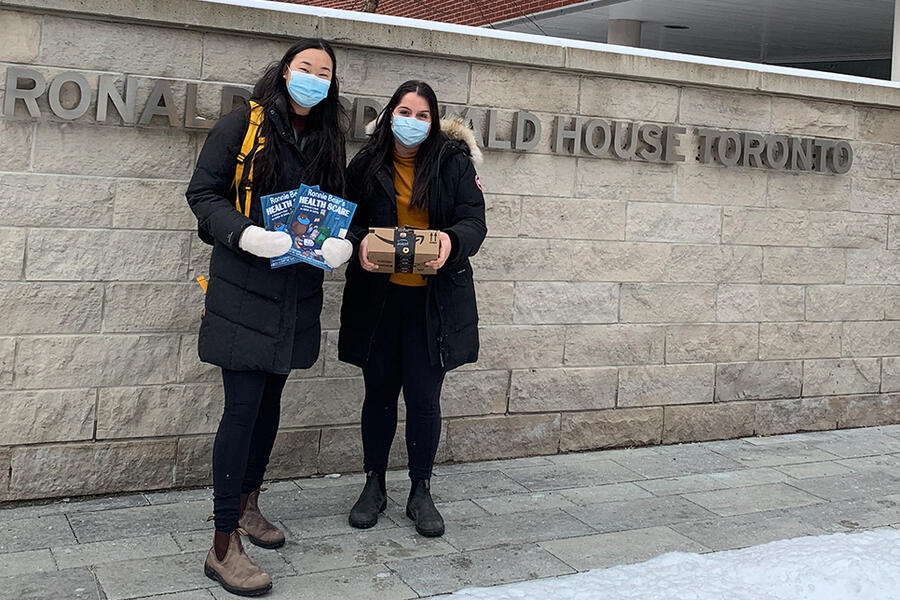 Sabrina Wang and Nairy Khodabakhshian with books