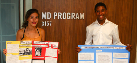 Mackenzie Richmond and Rogney Ingram showcase their research posters.