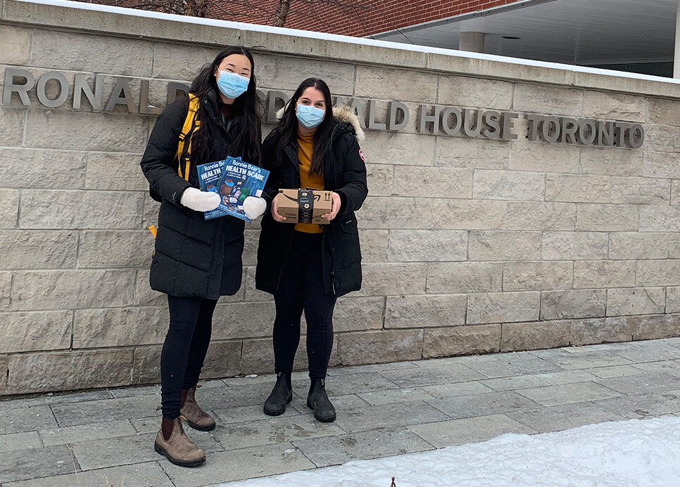 Sabrina Wang and Nairy Khodabakhshian with books